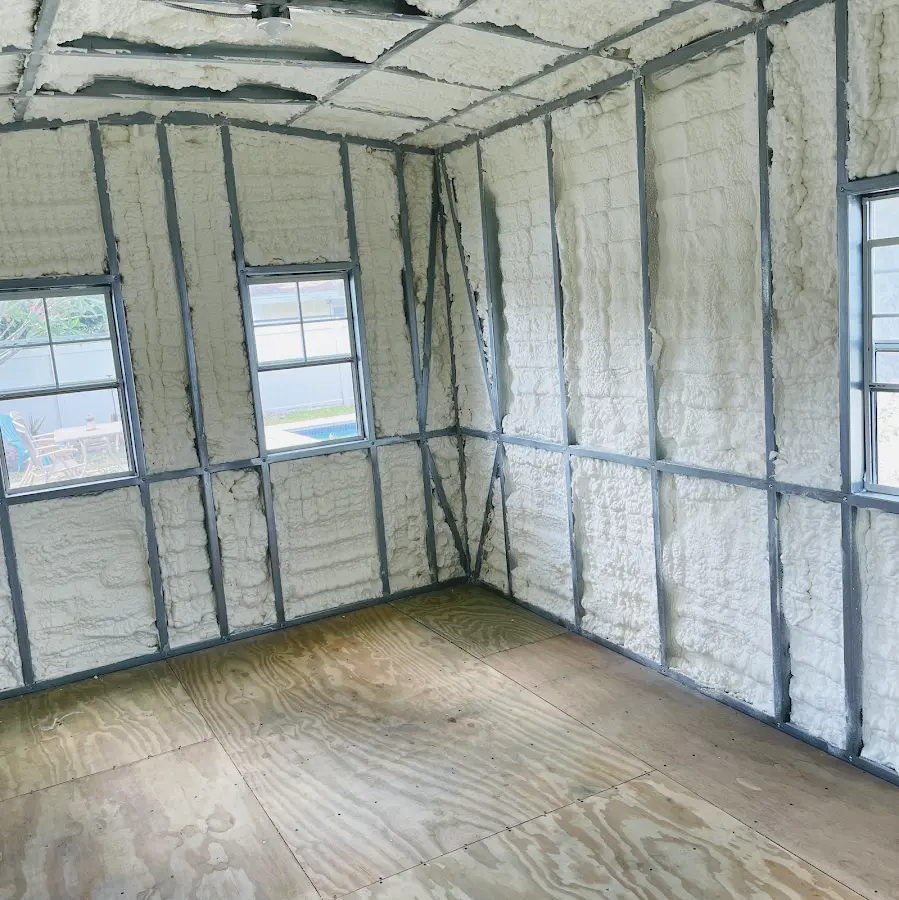 Closed-cell spray foam insulation applied to wall cavities in a residential project in Springtown
